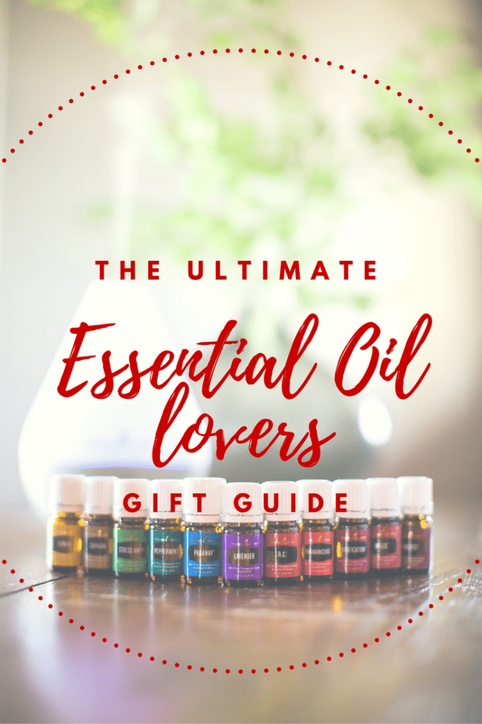 image of essential oils from the young living premium starter kit and free diffuser on a wood table with plant. Text overlay says the ultimate essential oil lovers gift guide