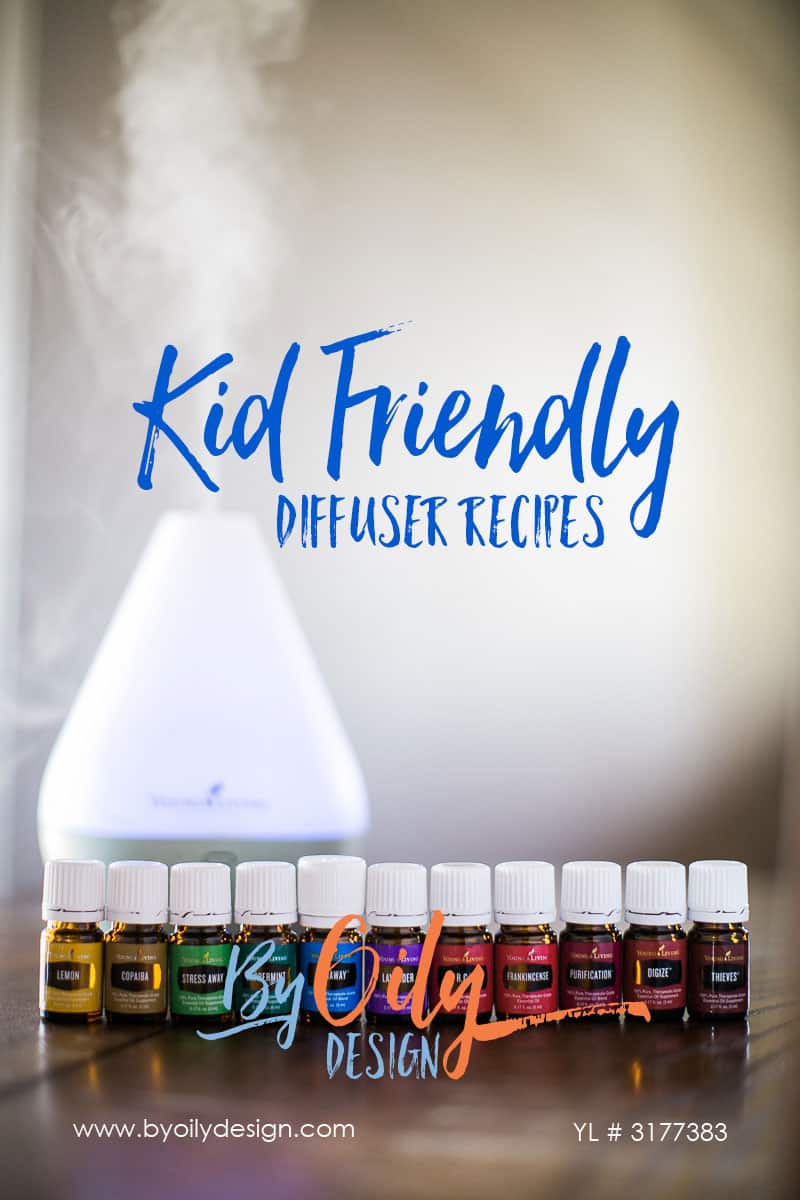 row of premium starter kit essential oils in front of a diffuser