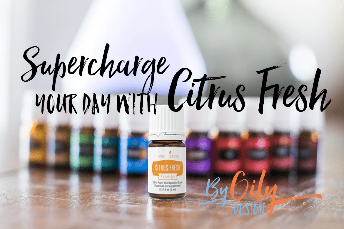 Bottle of Citrus Fresh Essential oil with other premium starter kit oils and a diffuser.