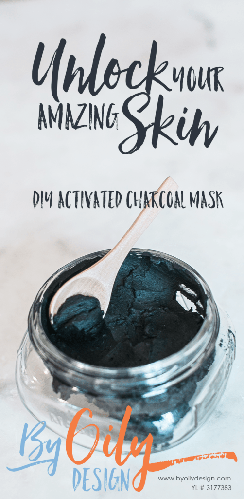 Glass jar with Charcoal mask and wooden spoon.