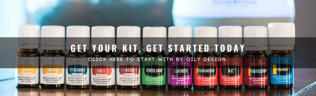 premium starter kit oils from Young Living on a wood table