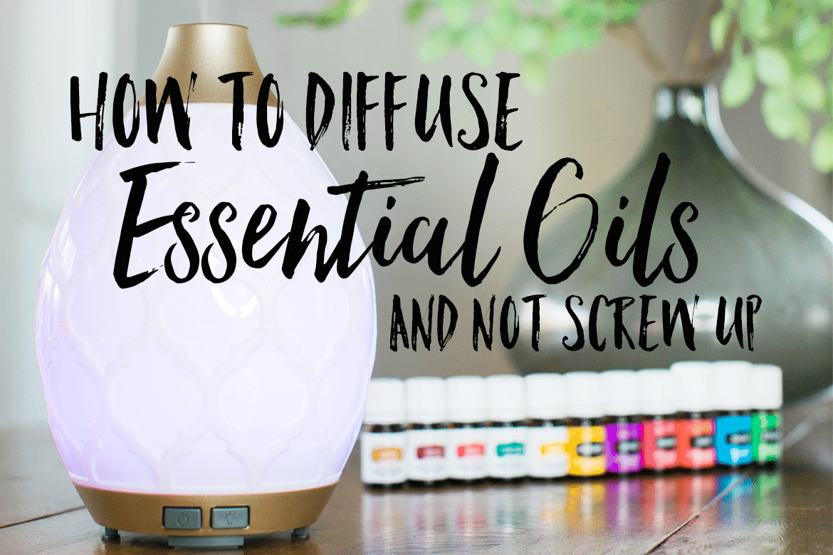 diffusing essential oils recipes with diffuser and essential oil bottles on a wood table