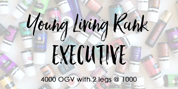 Text over lay of essential oil bottles- Young Living Rank of Executive 4000 OGV with 2- 1K legs.