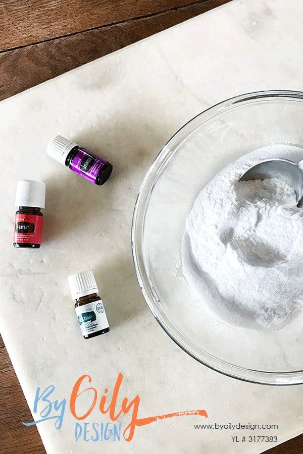 Essential oils and baking soda laid out on a table to ready to make shower steamers.