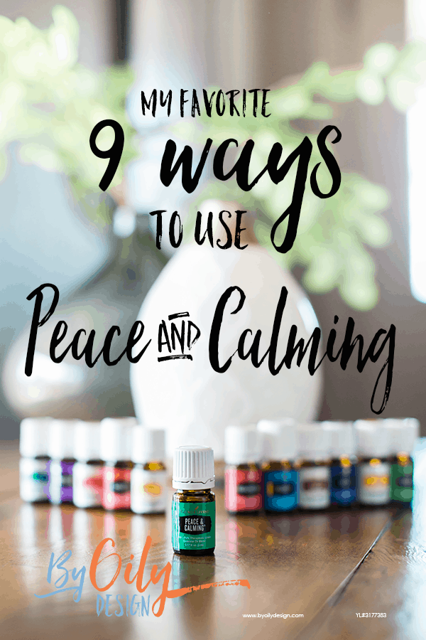 bottle of peace and calming essential oil with 11 other young living essential oils and a desert mist diffuser behind the oils. All are on a wooden table by a window with a plant