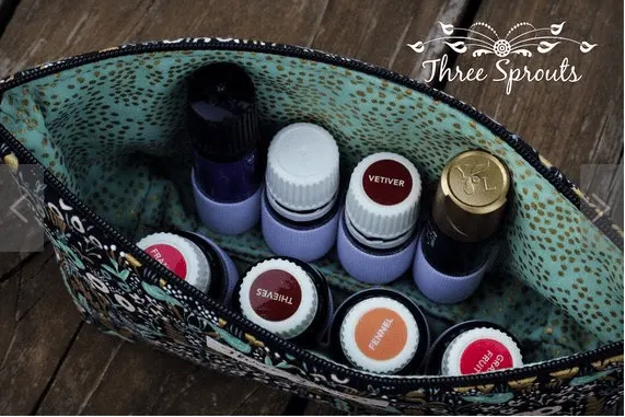 a look inside an essential oil bag holding 5ml and 10ml bottles. showing how they are secured on the sides so they stand up.