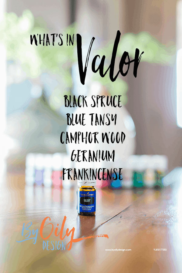 bottle of Valor essential oil with 11 other young living essential oils and a desert mist diffuser behind the oils. All are on a wooden table by a window with a plant