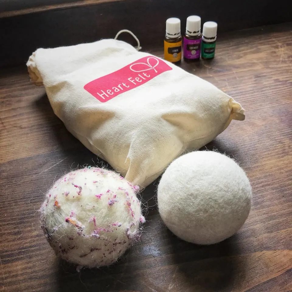Wool balls used in laundry to help dry clothes. Pictured with essential oils
