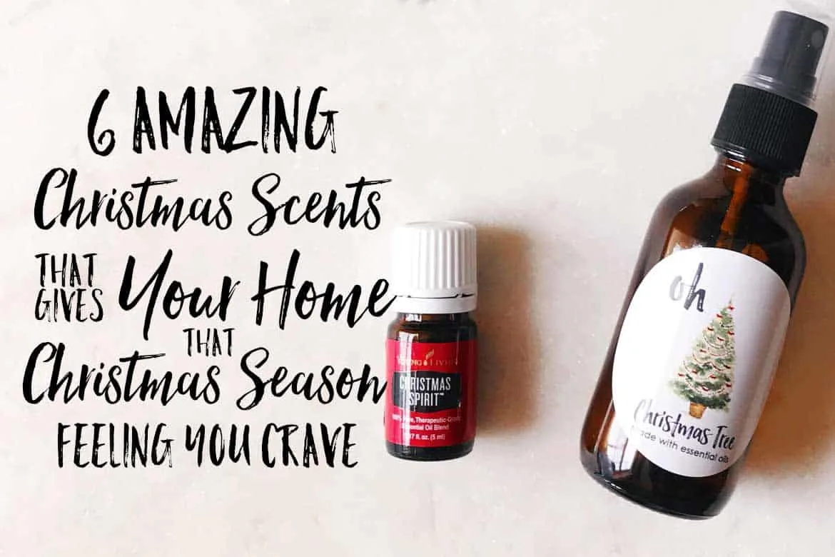 bottle of young living Christmas spirit with a room spray bottle next to it.