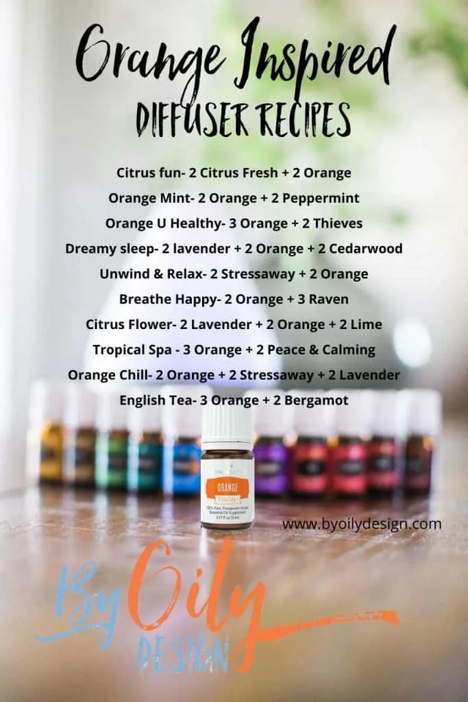 bottle of Orange essential oil on a table with other essential oils and a diffuser.