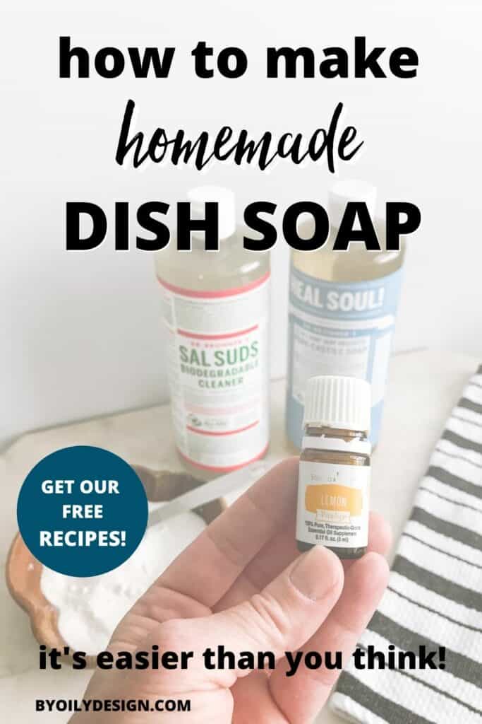 Image of bottle of Sal Suds, bottle unscented Castile Soap, bowl of washing powder on a marble counter top with a hand holding a bottle of lemon essential oil. The text overlay on the image says "Hoe to make homemade dish soap. Get our free recipes. It's easier than you think!"