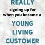 Essential oils laying on their sides blurred out on the back ground. Foreground text says "What are you Really signing up for when you become a Young Living Customer?"